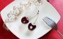 A Plate with Cherry and Tape Measure