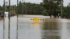 Flooded Street with a Sign