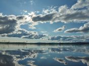 Blue sky and Clouds over Body of Water