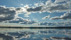 Blue sky and Clouds over Body of Water
