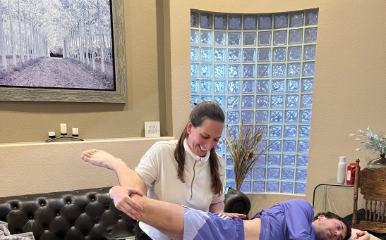 Dr. Kate Mihevc Edwards treating professional athlete Luciano
