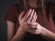 Woman Holding Her Hand