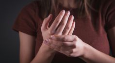 Woman Holding Her Hand