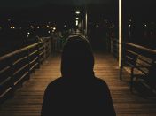 Person Wearing Hooded Jacket at Night