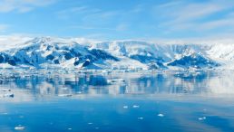 Large Body of Water and Snow Mountains