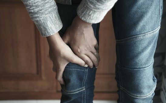 Person Holding the Knee