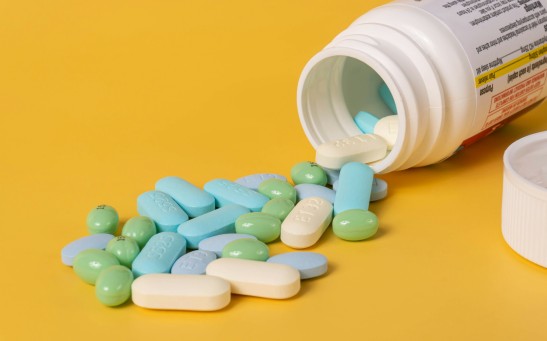 Mixed Pills Spilling Out of a Pill Bottle