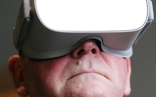 Bryan Thompson, patient of the virtual reality app Reducept, poses for a picture with VR headset at the Dutch medtech start-up office in Leeuwarden, Netherlands February 26, 2020. Picture taken February 26, 2020.