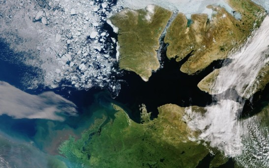 One can see the sea ice in the Canadian Archipelago's waterways, as well as well as the cracked sea ice found in the Beaufort Sea