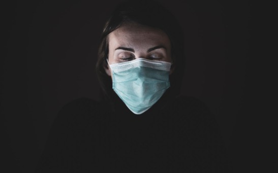 woman-in-black-shirt-and-face-mask-4056206