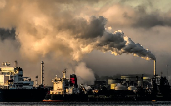 White and black ship on sea under white clouds