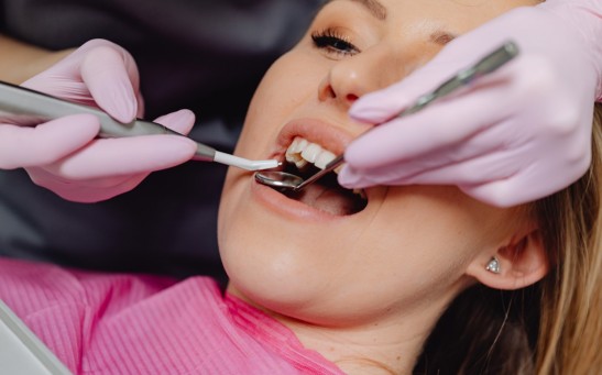 Photo of a Woman Getting a Dental Check Up