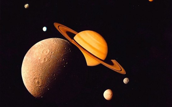 NASA's Cassini Space Probe Captivates the Enchanting Realm of Saturn's Moons