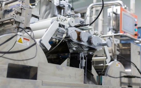 Big steel chromed manufacture machine with shafts and computer control panel from bellow